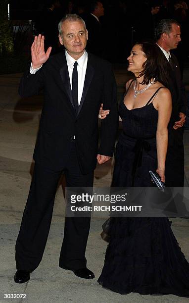 Best Actor nominee Bill Murray and his wife Jennifer Butler arrive at the Vanity Fair Post Oscar Party, 29 February in West Hollywood, California....