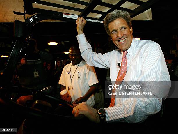 Democratic presidential candidate, Massachusetts Senator John Kerry tries his hand at driving a forklift at Roadway Express Shipping 02 March 2004 in...