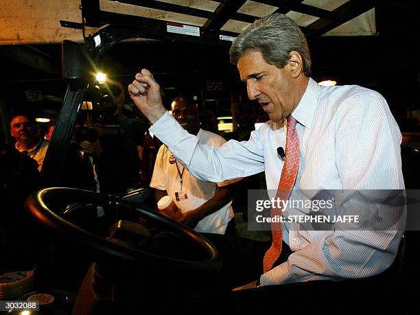 Democratic presidential candidate, Massachusetts Senator John Kerry tries his hand driving a forklift at Roadway Express Shipping 02 March, 2004 in...