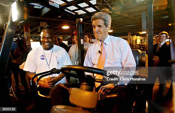 Senator John Kerry plays with a forklift at a loading dock on March 2, 2004 in Atlanta, Georgia. Kerry began his 'Super Tuesday' in Atlanta....