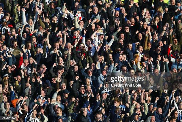 Newcastle United fans celebrate Craig Bellamy's goal during the FA Barclaycard Premiership match between Portsmouth and Newcastle United at Fratton...