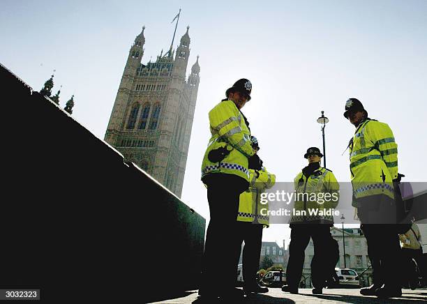 Metropolitan police officer patrols the streets of Westminster March 2, 2004 in London. The government today announced figures showing that police...