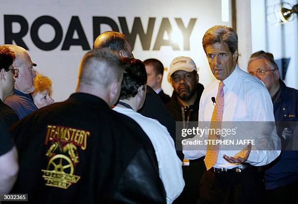 Democratic presidential candidate, Senator John Kerry ,D-MA, talks with workers at Roadway Express Shipping 02 March 2004 in Atlanta, Georgia. Kerry...