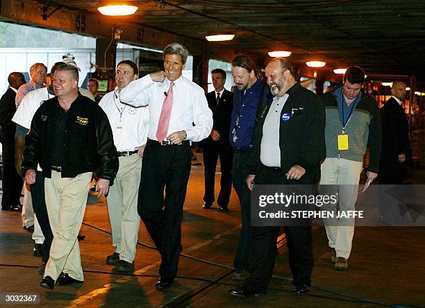 Democratic presidential candidate, Senator John Kerry ,D-MA, walks with workers at Roadway Express Shipping 02 March 2004 in Atlanta, Georgia. Kerry...