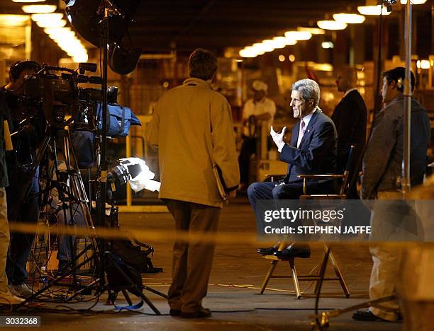 Democratic presidential candidate, Massachusetts Senator John Kerry does several television interviews prior to touring the Roadway Express Shipping...