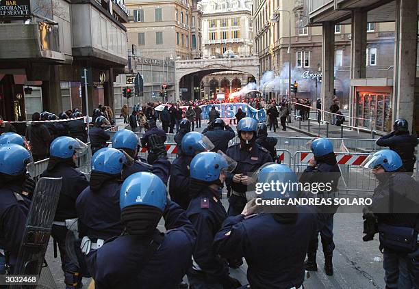 Several hundreds of demonstrators protest outside Genoa's courthouse, 02 March 2004 as 26 people went to trail for rioting and looting during the...