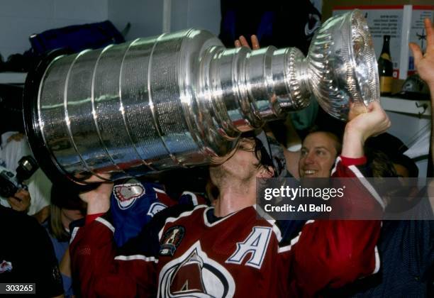 Center Mike Ricci of the Colorado Avalanche holds the Stanley Cup during a playoff game against the Florida Panthers at the Miami Arena in Miami,...