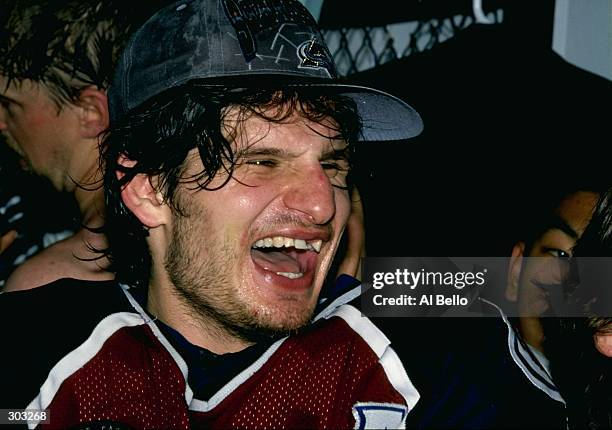Center Mike Ricci of the Colorado Avalanche holds the Stanley Cup during a playoff game against the Florida Panthers at the Miami Arena in Miami,...