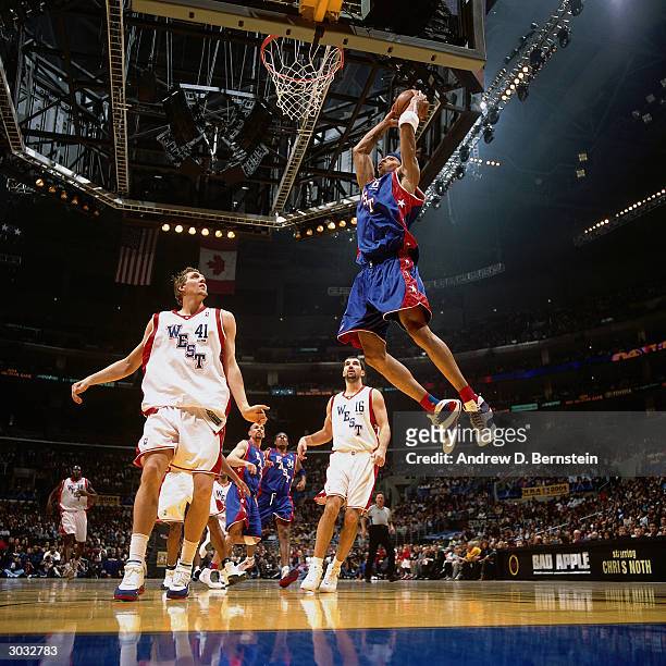 Kenyon Martin of the East All-Stars attempts a dunk against the West All-Stars during the 2004 NBA All-Star Game at the Staples Center part of the...