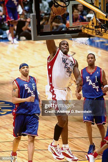 Shaquille O'Neal of the West All-Stars goes in for the slam dunk against the East All-Stars during the 2004 NBA All-Star Game at the Staples Center...