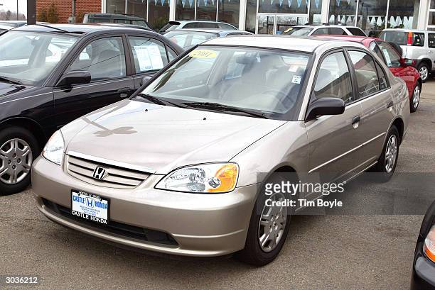 Honda Civic is seen for sale at Castle Honda March 2, 2004 in Morton Grove, Illinois. Honda is recalling approximately 440,000 Civic and Insight...