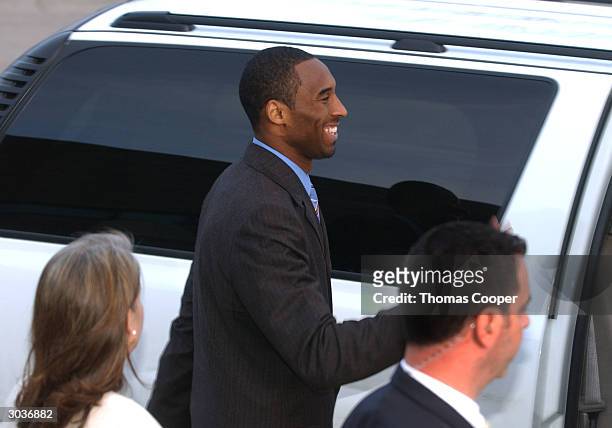 Los Angeles Lakers star Kobe Bryant reacts to local area kids who were holding signs proclaiming Bryant's innocence March 2, 2004 in Eagle, Colorado....