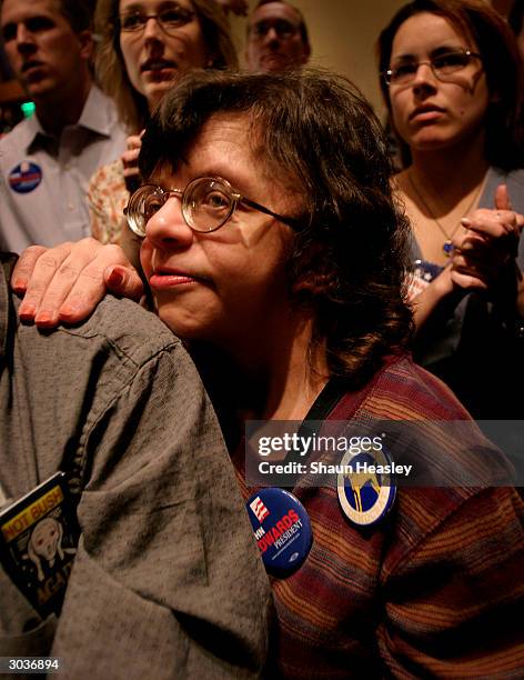 Dejected supporters listen to 2004 Presidential Candidate Sen. John Edwards during a speech at the Georgia Tech Hotel and Conference Center March 2,...
