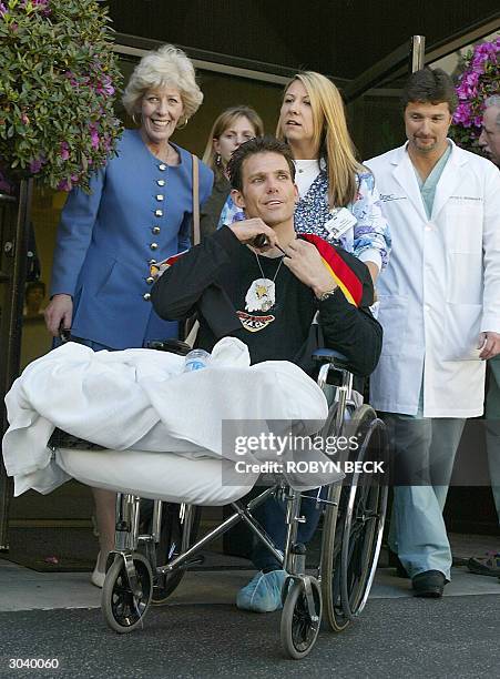 Eric LeMarque arrives with his mother Susan LeMarque and Dr Peter Grossman for a press conference at the Grossman Burn Center at Sherman Oaks...