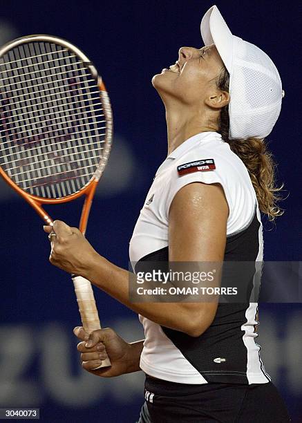 Spaniard Marta Marrero celebrates after defeating Amanda Coetzer of South Africa 7-5, 6-3 in a second round tennis match of the Mexican Open in...