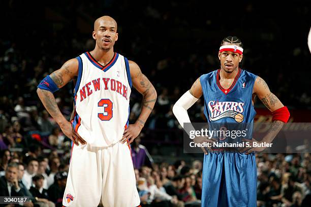 Allen Iverson of the Philadelphia 76ers and Stephon Marbury of the New York Knicks wait for play to ressume March 3, 2004 at Madison Square Garden in...