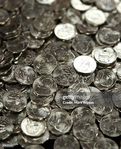 Newly designed nickels on display during a ceremony at the U.S. Mint Headquarters March 4, 2004 in Washington, DC. The coins from the "Westward...