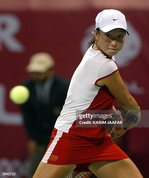 China's 20-year-old Jie Zheng Anastasia returns the ball to Anastasia Myskina of Russia during their quarter final match in the WTA Qatar Open...