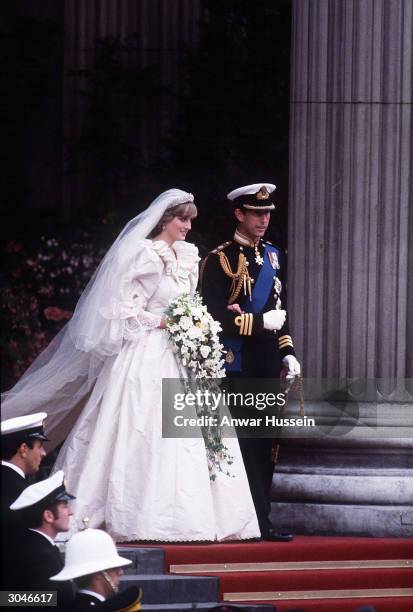 Prince Charles, Prince of Wales and Diana, Princess of Wales, wearing a wedding dress designed by David and Elizabeth Emanuel and the Spencer family...