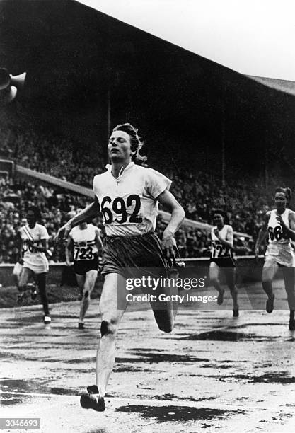 Fanny Blankers-Koen of the Netherlands wins the Gold in the 200m during the XIV Olympic Games Circa August of 1948 in London, England.