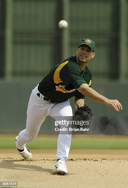 Tim Hudson of the Oakland A's warms up for a game against the Milwaukee Brewers on March 5, 2004 at Phoenix Municipal Stadium in Phoenix, Arizona....