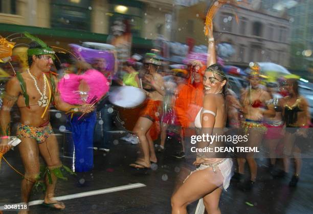 Members of Sydney's Central Dance Studio get into their act despite the rain at the 26th Sydney Gay & Lesbian Mardi Gras, Sydney, Australia, 06 March...