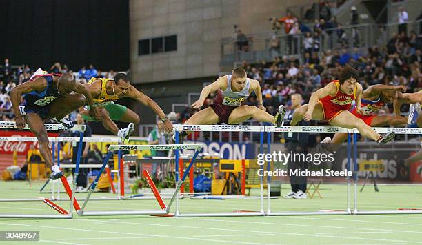 Allen Johnson of USA wins the men's 60 metres hurdles final from Xiang Liu of China during the IAAF World Indoor Championships at the Budapest...