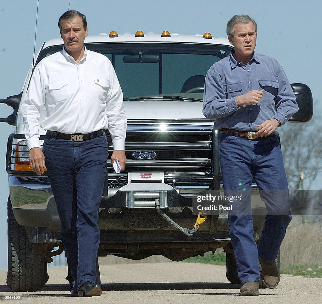 U.S. President George W. Bush and Mexican President Vicente Fox walk ...