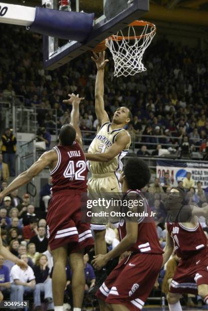 Brandon Roy of the Washington Huskies shoots against Rob Little of the Stanford Cardinal March 6, 2004 at Hec Edmundson Pavilion in Seattle,...