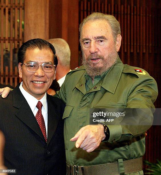 Vietnamese Communist Party chief Nong Duc Manh is welcomed by Cuban President Fidel Castro on March 6, 2004 at the Revolution Palace in Havana, Cuba....