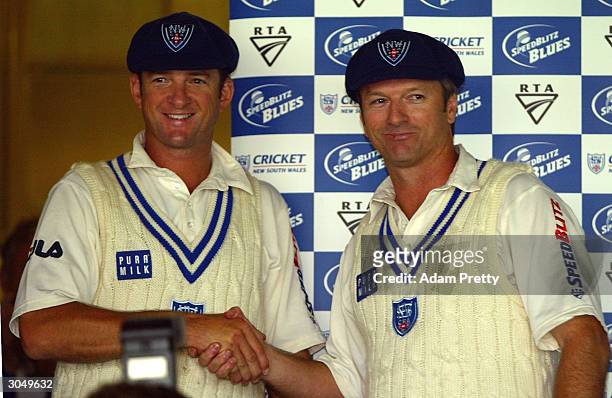 Mark Waugh and Steve Waugh of the Blues shake hands after being presented with commorative caps to mark the end of their cricketing careers during...