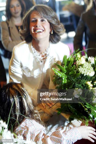 Syrian First Lady Asma Al-Assad, wife of President Bashar al-Assad, smiles upon her arrival in Beirut March 07, 2004. Arab first ladies are gathering...