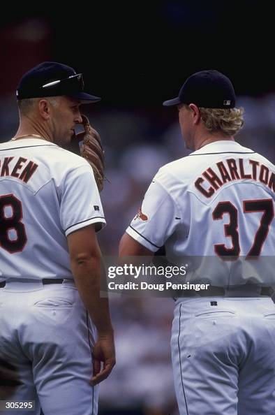 Infielder Cal Ripken of the Baltimore Orioles stands with pitcher ...