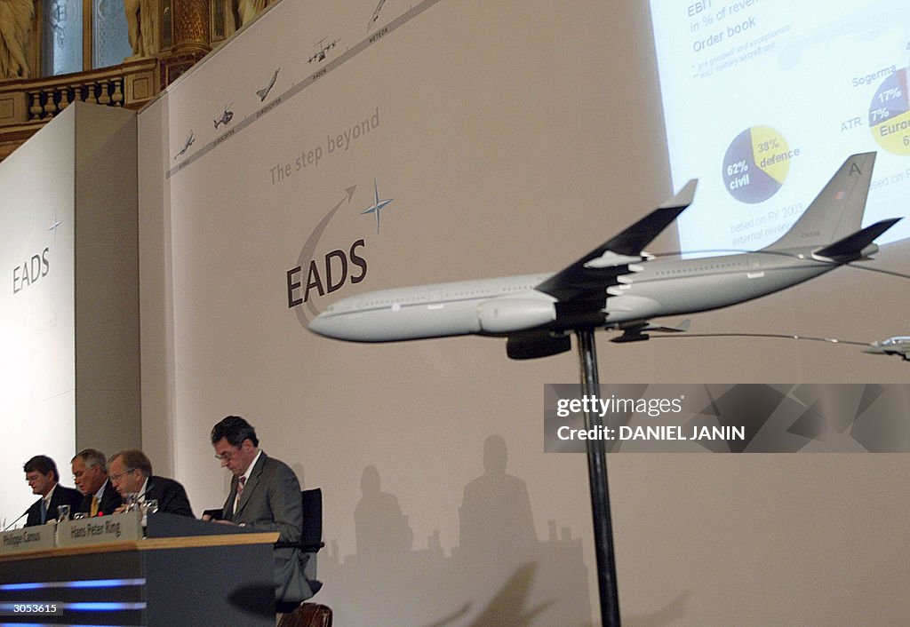 Members of EADS board Christian Poppe (L