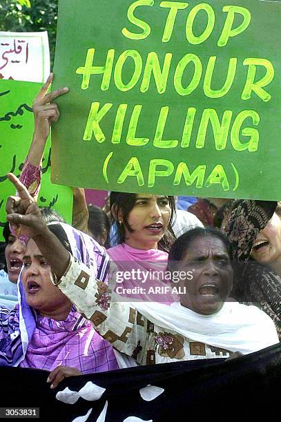 Pakistani women workers shout slogans during a demonstration to protest violence against women, on the International Women's Day in Lahore, 08 March...