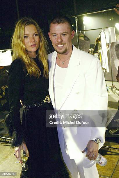 Designer Alexander McQueen poses with model Kate Moss at the Alexander McQueen ready-to-wear Fall-Winter collection 2004-2005 fashion show on March...
