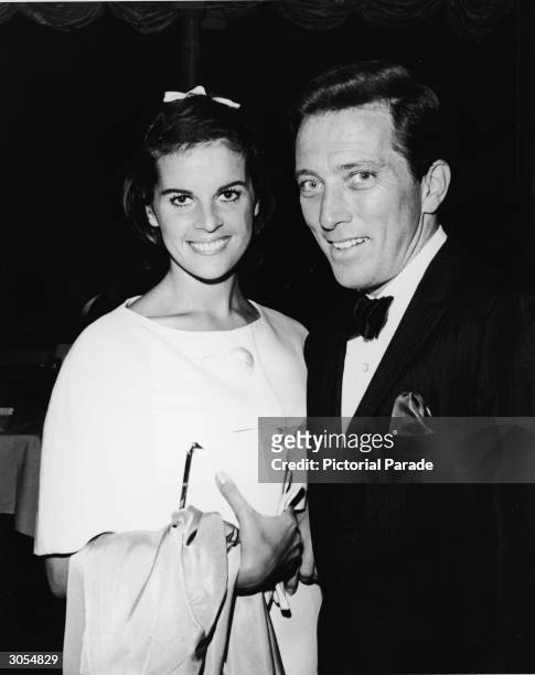 American pop singer Andy Williams and his wife, French singer and actor Claudine Longet, smile as they attend singer Bobby Darin's opening night...