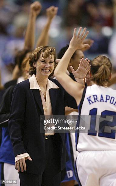 Head coach Gail Goestenkors celebrates with player Vicki Krapohl of the Duke Blue Devils during their 63-47 victory versus the University of North...