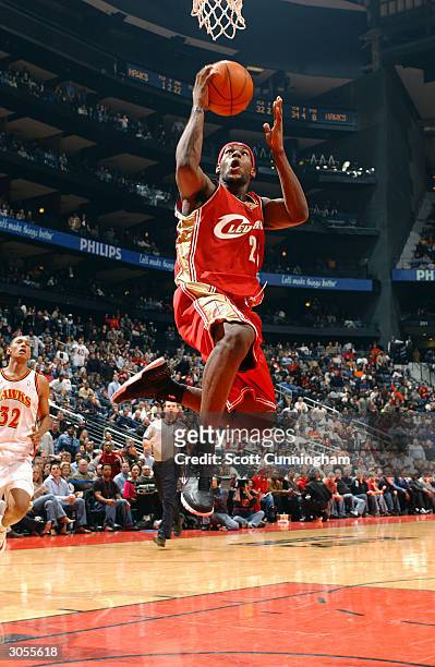 LeBron James of the Cleveland Cavaliers shoots a layup against the Atlanta Hawks March 8, 2004 at Philips Arena in Atlanta, Georgia. NOTE TO USER:...