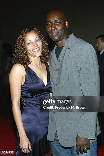 Actor Michael Jace and April Jace attend the third season premiere screening of "The Shield" at the Zanuck Theater on March 8, 2004 in Los Angeles,...