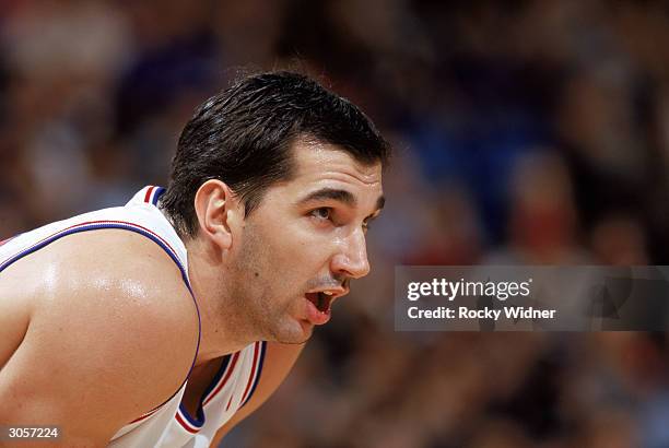 Predrag Stojakovic of the Sacramento Kings leans over during the game against the New York Knicks at Arco Arena on February 24, 2004 in Sacramento,...