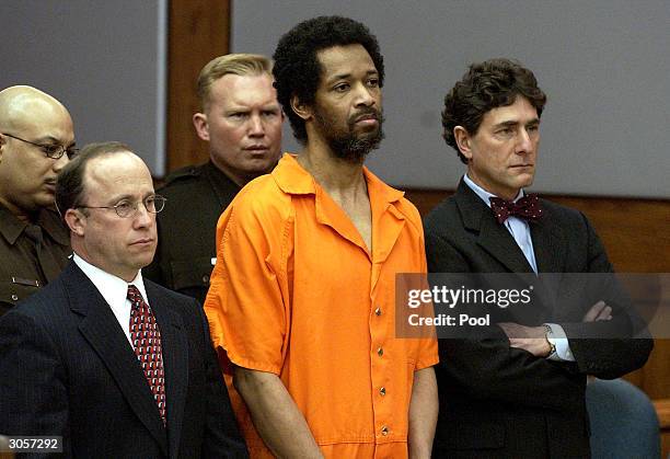 Convicted sniper suspect John Allen Muhammad stands expressionless with his attorney's Peter Greenspun and Jonathan Shapiro as he is sentenced to...