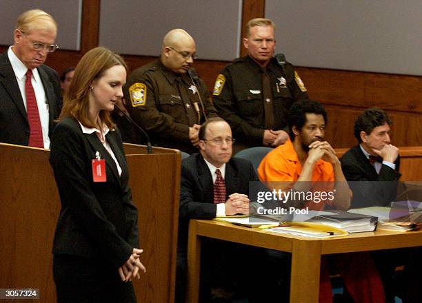 Katrina Hannum , daughter of sniper victim Linda Franklin, passes in front of the defense table where convicted sniper John Allen Muhammad and his...