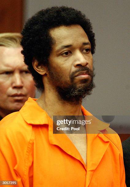 Convicted sniper suspect John Allen Muhammad stands expressionless as he is sentenced to death for the shooting of Dean Meyers at the Prince William...