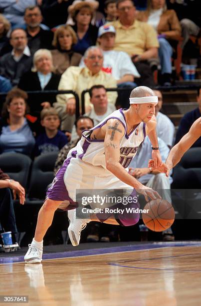 Mike Bibby of the Sacramento Kings drives during the game against the Utah Jazz at Arco Arena on February 27, 2004 in Sacramento, California. The...