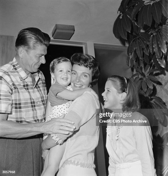 Portrait of American actors Ronald Reagan and Nancy Reagan and their children, 2-year-old Ronald Prescott Reagan and 9-year-old Patricia Ann at the...