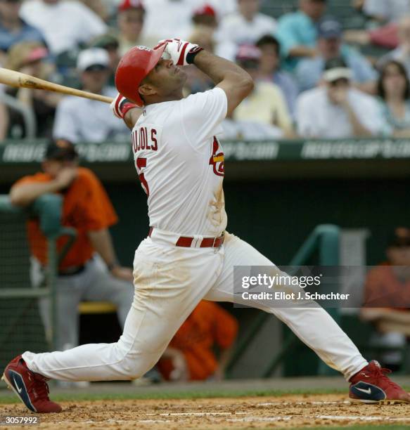 First basemen Albert Pujols of the St. Louis Cardinals watches a foul ball against the Baltimore Orioles during Spring Training March 9, 2004 at...