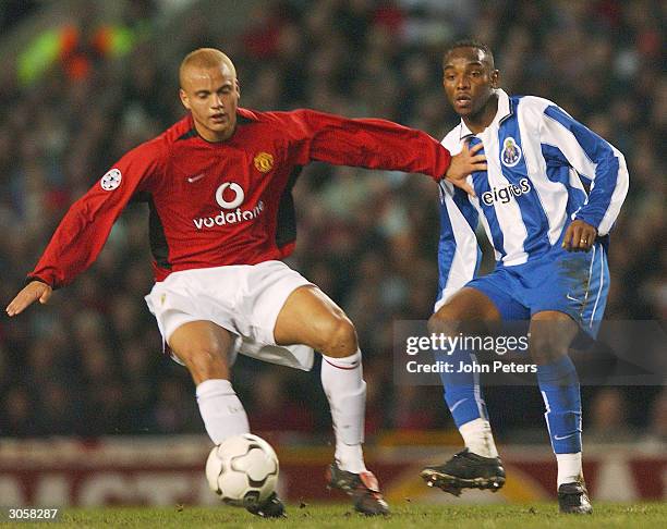 Wes Brown of Manchester United holds off Benni McCarthy of FC Porto during the UEFA Champions League match between Manchester United and FC Porto at...