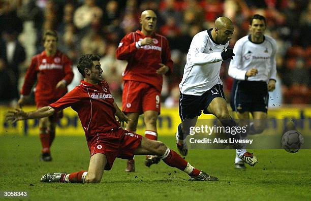 Franck Queudrue of Middlesbrough clashes with Stephane Dalmat of Spurs during the FA Barclaycard Premiership match between Middlesbrough and...