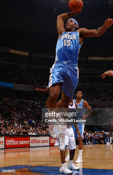 Carmelo Anthony of the Denver Nuggets goes up for a dunk against the Washington Wizards in NBA action March 9, 2004 at the MCI Center in Washington...
